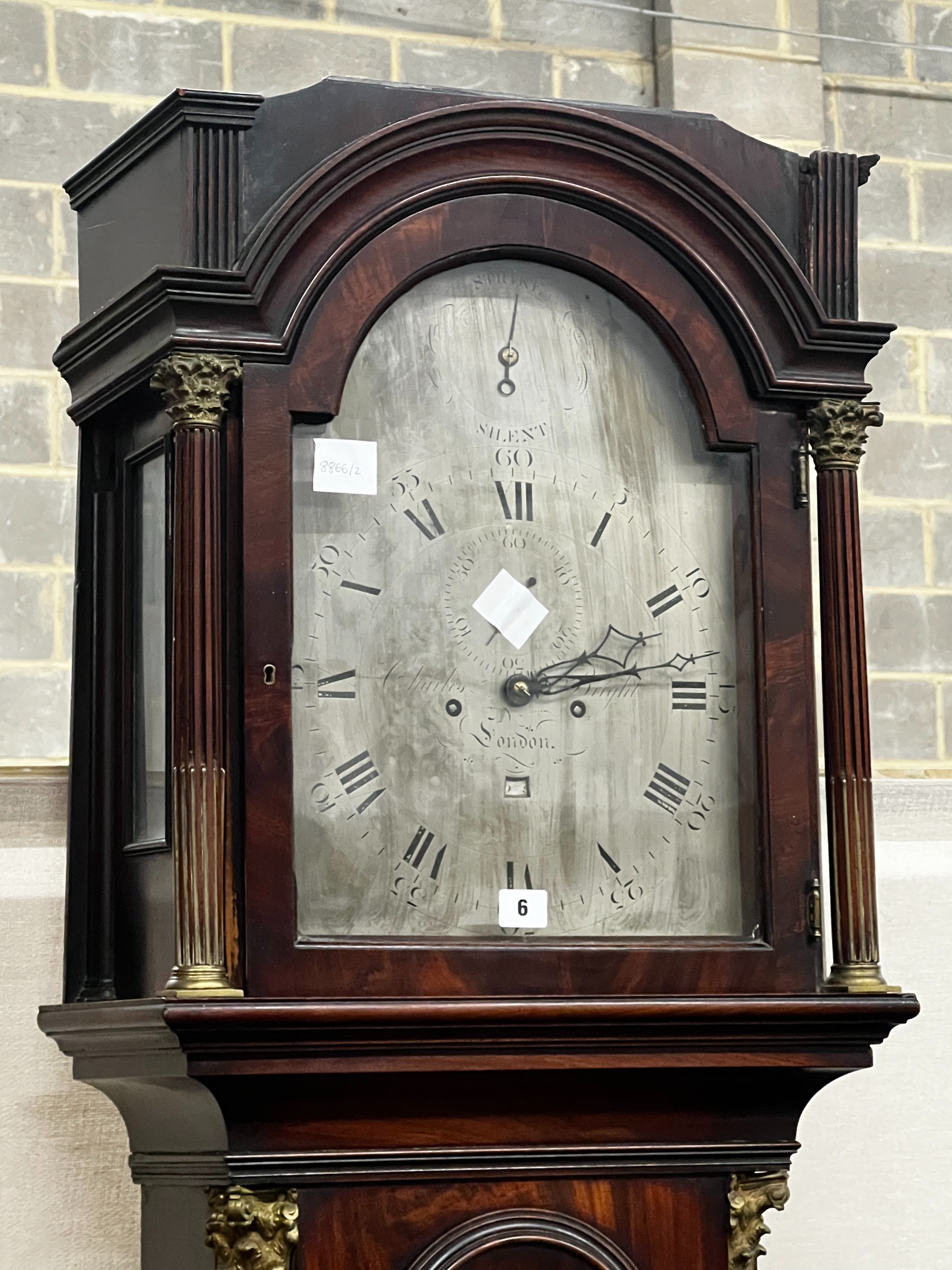 A George III mahogany 8 day longcase clock, the 12in arched silvered dial, marked Charles Bright, London, height 219cm
